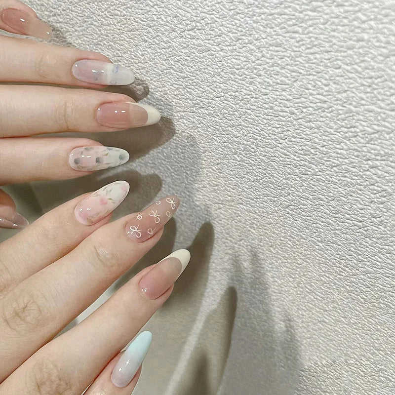 Qfdian 24Pcs Almond Press on Fake Nails Long French False Nails with Pink Bow Wearable Flower Design Oval Manicure Full Cover Nail Tips