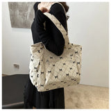 Qfdian Single shoulder crossbody bow, fresh underarm texture, large capacity tote bag, handbag, women's bag