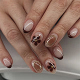 Qfdian  24pcs Sweet Pink Flower Press On Nails Glossy Short Almond Full Cover Stick-on Nails Gold Stripe Blush Artificial False Nails