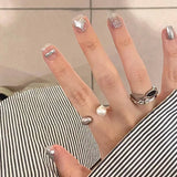 Qfdian 24Pcs Simple False Nails with Glue Short Almond Fake Nails Glitter Aurora Round Head Full Cover Nail Tips Oval Press on Nails