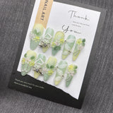 Qfdian  Nature-Inspired Soft Green Floral Press-On Nails with Flexible Silk Botanicals and Oxidation-Resistant Metal Details Perfect for