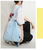 Qfdian Patchwork Contrast Color Nylon Preppy Backpack Women Students Y2k Casual Travel Schoolbags Japanese Drawstring Pleated Backpacks